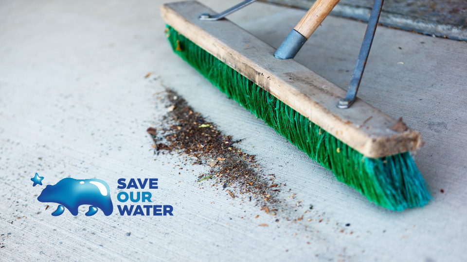 Save Our Water, broom sweeping up dirt and debris